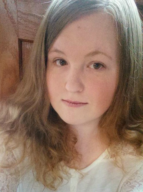 A headshot of the author (Emily Stevens), smiling.