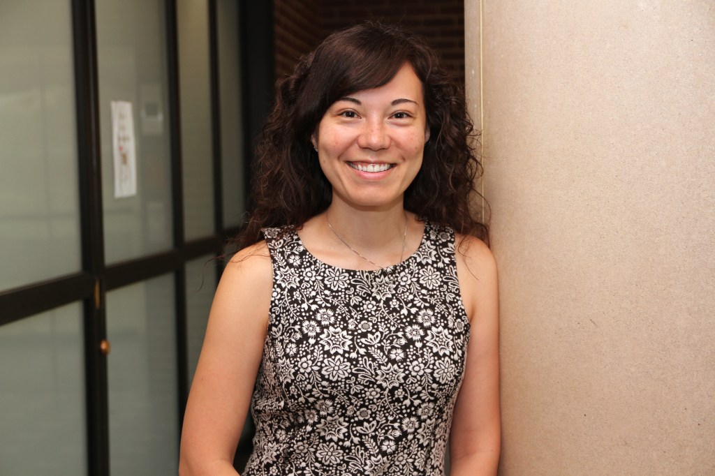 Michele Burney a woman with brown hair and flower top. 