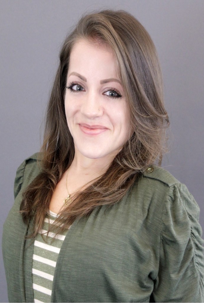 the author, Caroline Muster, wears a green jacket with a gray background